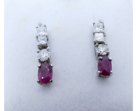 A pair of ruby and diamond drop earrings on 18ct white gold wires