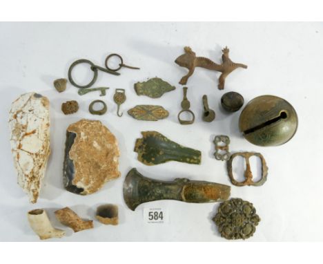 A small collection of excavated antiquities. To include an early bronze age axe head with curved blade, pre-historic stone ha