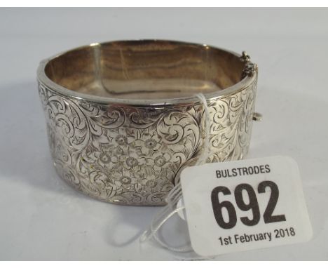 Hallmarked silver wide bangle  Some small dents and dings, safety chain broken.
