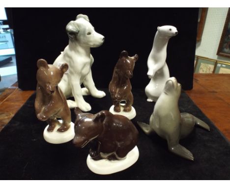 A collection of Russian porcelain animals to include three bears, stoat, seal and a model Laika - the first dog in space 
