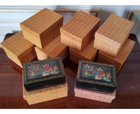 Nine Russian style lacquer trinket boxes, hinged lid, velvet interior, decorated with a classical Russian fairy tale scene (9