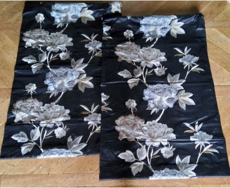 A pair of Roman blinds, machine embroidered roses in tones of cream, grey &amp; gold on black silk, lined, roller &amp; chain