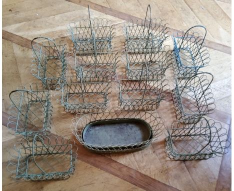 Twelve centrepiece wirework baskets, green; an oval wirework planter (13) 