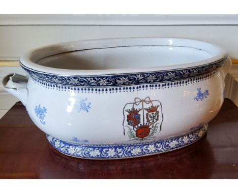 A 19th century French large blue &amp; white two handled ceramic basin decorated with flowers and&nbsp; family crest/armorial