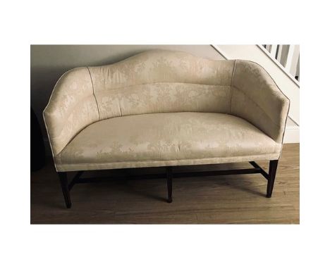 A George III two seater sofa, cream damask fabric, h-stretcher tapering mahogany legs 