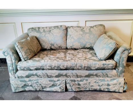 A small country house two seater 'loving seat' sofa with bold floral damask upholstery in tones of soft green, 145cm W x 90cm