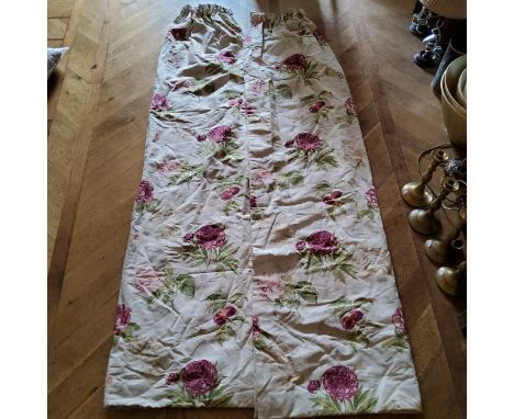 A pair of pencil pleat linen curtains printed with peonies and nectarines in tones of red, pink &amp; green on a cream ground