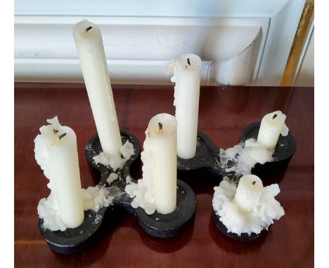 A pair of vintage David Mellor three light black serpentine cast iron candle holder, stamped "David Mellor 1972" 