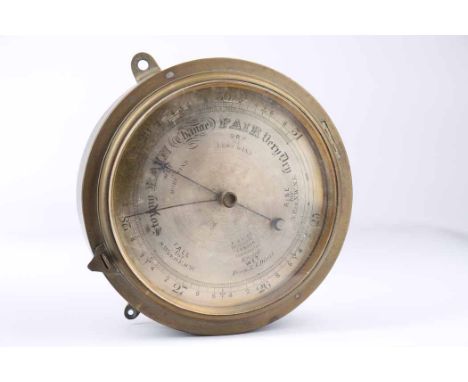 BRASS BULKHEAD BAROMETER 
by E. White, 20 Cockspur Street, London, signed silvered dial, blued steel hands, 22cm diameter