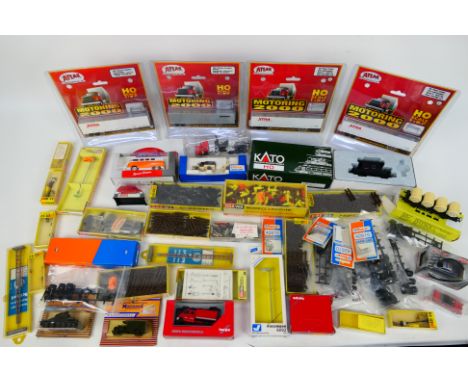 Atlas - Schuko - Busch - Roco - BraWa - Kato. A selection of Forty boxed and bagged items for model railways including cars, 