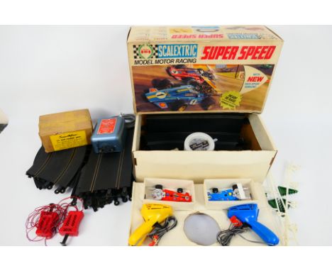 Scalextric - A boxed vintage Scalextric Super Speed Set with a quantity of loose track, two Matchbox loose hand throttles and