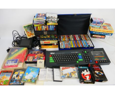 Amstrad - An unboxed Amstrad CPC 464 personal computer with Amstrad MP1 Module, cables, manual plus a collection of over 80 m