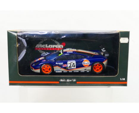 Paul's Model Art - Minichamps - A boxed McLaren F1 GTR Gulf Le Mans car # 151824. The car is slightly dusty from display and 