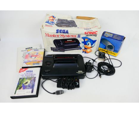 Sega - A boxed vintage Sega Master System II, which contains console, adapter, instruction manual, controller, plus 2 boxed S