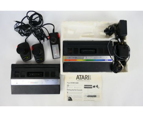 Atari - A partially boxed Atari 2600 in polystyrene tray only with its power adapter cable, instructions and controller; toge
