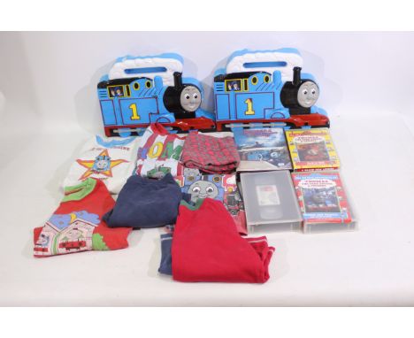 Ertl, Other - A collection of Thomas The Tank Engine items to include, 16 x Ertl locomotives, planes, wagons, 4 x videos, and