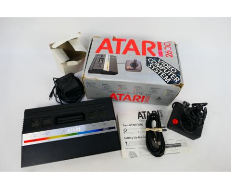 Atari - A boxed vintage Atari 2600 Video Computer System. Item contains console, adapter, cable, controller and manual / inst