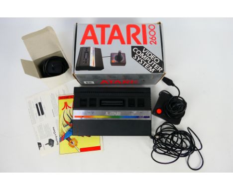 Atari - A boxed vintage Atari 2600 Video Computer System. Item contains console, adapter, cable, controller and manual / inst