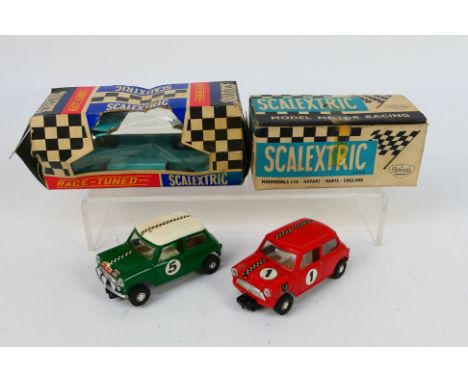 Scalextric. Two boxed electric models appearing in Excellent condition with Poor - VG boxes. #5 Mini Cooper in Green & #C76 M