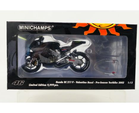 Minichamps - A boxed 1:12 scale Valentino Rossi Collection limited edition Honda RC211V 2002 pre-season testbike # 122027946.