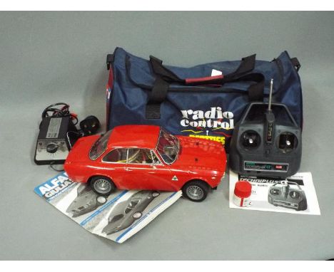 Tamiya - An unboxed and built 1:10 scale Alfa Romeo Giulia Sprint GTA Remote Control Car. The car overall appears to be in Ex