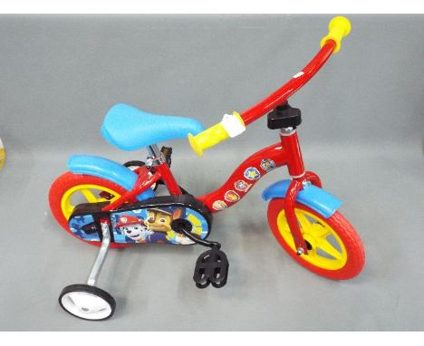 Dino - An unboxed Dino 12" inch frame Paw Patrol childrens bicycle. Item is built and is retail stock. 