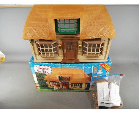 Sylvanian Families, Tomy - A boxed Sylvanian Families Meadowcroft Cottage Set in Playworn condition in a Fair - Good box. The