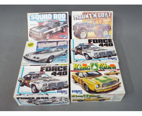 MPC - Six boxed 1:24 scale model kits by MPC. Lot includes King Cobra; Mount'n Goat; Force 440 and similar. Some models kits 