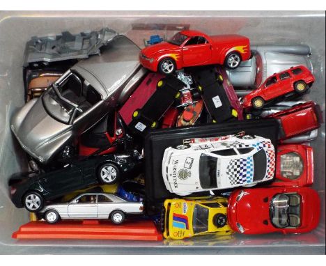 Maisto, Bburago, and Others - A quantity of unboxed diecast model vehicles predominately 1:24 scale. All items are in Playwor