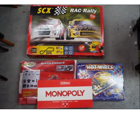 Scalextric, SCX, Waddingtons and Others - A group of  two boxed slot car racing games, with a boxed vintage Monopoly game and