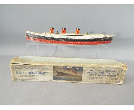 Chad Valley - A boxed Chad Valley "Take to Pieces" model of the RMS Queen Mary Liner. The model is assembled with flat card s
