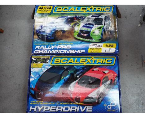 Scalextric - Two boxed Scalextric sets including Rally Pro Championship an Bugatti Veyron Hyperdrive Set. Both sets are in Pl