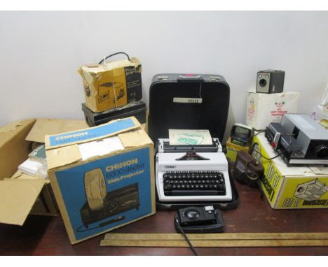 A mixed lot to include projectors, viewers, cameras, rules and various envelopes, along with an Erika typewriter