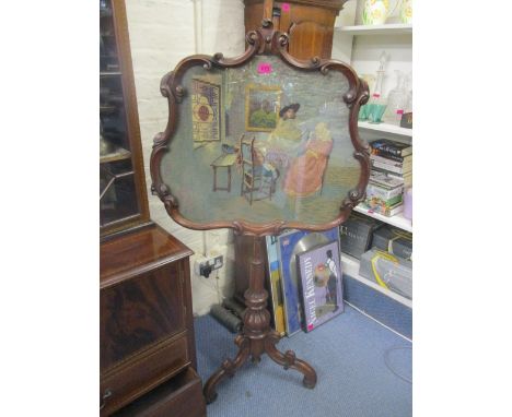 An early Victorian mahogany pole screen with tapestry panel depicting an interior scene A/F