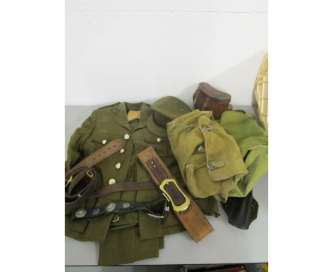 A mid to late 20th century army uniform, comprising a jacket, trouser and a cap, a selection of leather belts, military issue