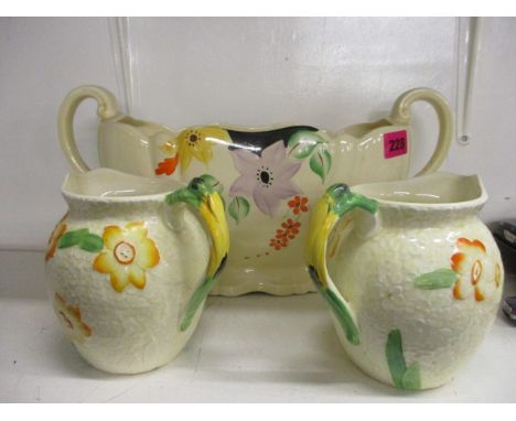 A Crown Devon planter and a pair of Grindley jugs