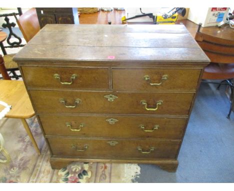 An early 18th century oak chest of two short and three graduated long drawers, raised on bracket feet, 37h x 37 x 20w
