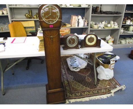 A group of early 20th century oak cased clocks to include a  Granddaughter clock and two mantle clocks