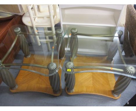 A pair of metal and maple lamp tables, each with a glass top, with spiral columns