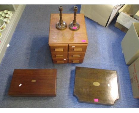 A small group of furniture to include a small, six drawer cabinet, empty cutlery boxes and a pair of mahogany candlesticks