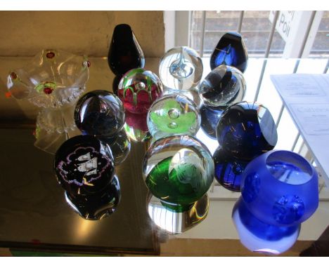 Eleven late 20th century Caithness glass paperweights to include Mystique and a Green Tiger paperweight, together with a peac