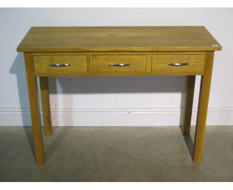 An oak three drawer hall/console table 78cm tall x 110cm x 42cm 
