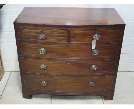 A Georgian mahogany and bow front cross banded chest, with two short over three long drawers on bracket feet, 107cm W x 96cm 