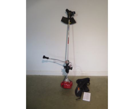 A petrol manual Mountfield MB3320 brush cutter and harness - in running order 