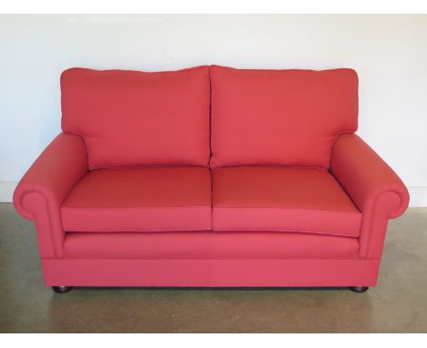 An ex-display as new Greengate Churchill two and a half seater sofa in red 