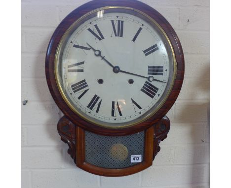 An 8 day wall clock strikes on a bell, in a rosewood and mahogany case