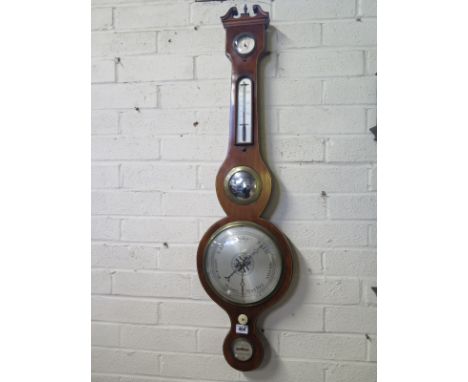 A mahogany barometer with hydrometer and thermometer above a mirror and silvered dial, the level signed Lickert Cambridge - 9