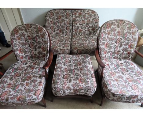 Ercol 20th century oak country style stick back settee with two armchairs and stool

All in reasonable used condition, scuffs