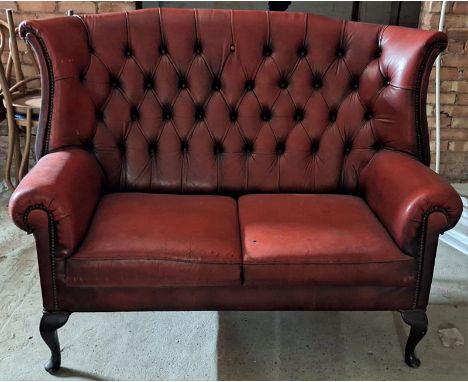 Chesterfield button back two seater settee. Approx. 108cm H x 147cm W x 69cm D

used condition, damage to leather in places, 