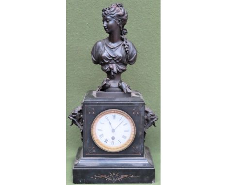 Victorian black slate mantle clock with circular enamelled dial, plus bust decoration to top. Approx. 49cm H

Used condition,